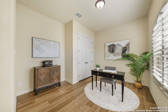 office space with light hardwood / wood-style floors