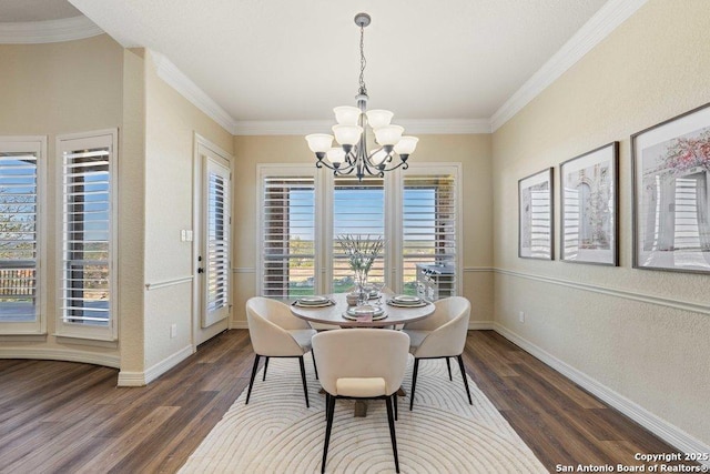 dining space featuring ornamental molding, dark hardwood / wood-style floors, and an inviting chandelier