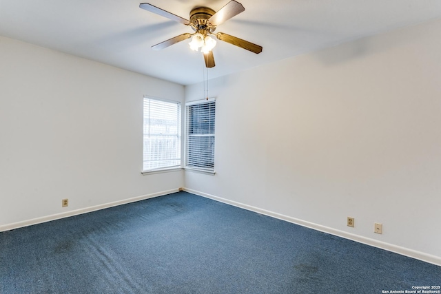 spare room featuring ceiling fan and carpet flooring