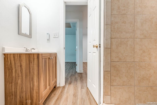 bathroom featuring vanity and hardwood / wood-style floors