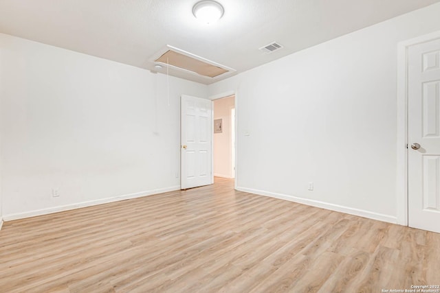 spare room with light wood-type flooring