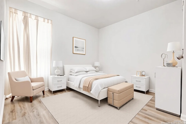 bedroom featuring light wood-type flooring