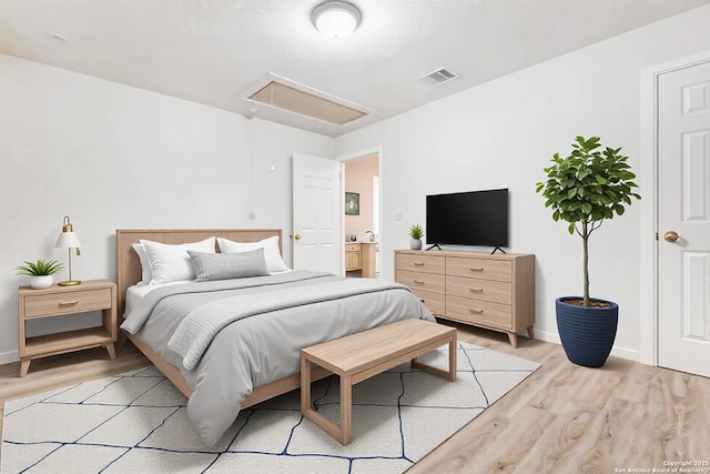 bedroom with light wood-type flooring