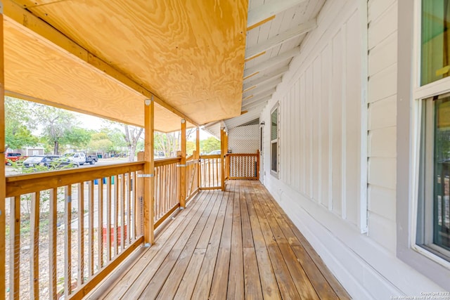 wooden deck featuring covered porch