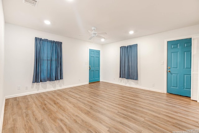 spare room featuring ceiling fan and light hardwood / wood-style floors