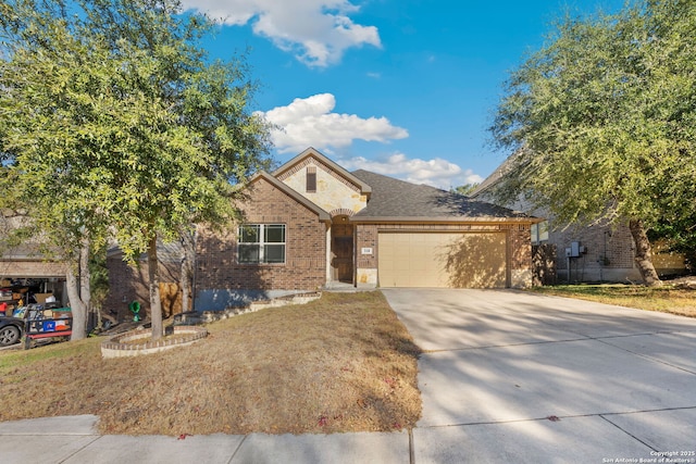 view of front facade featuring a garage and a front lawn