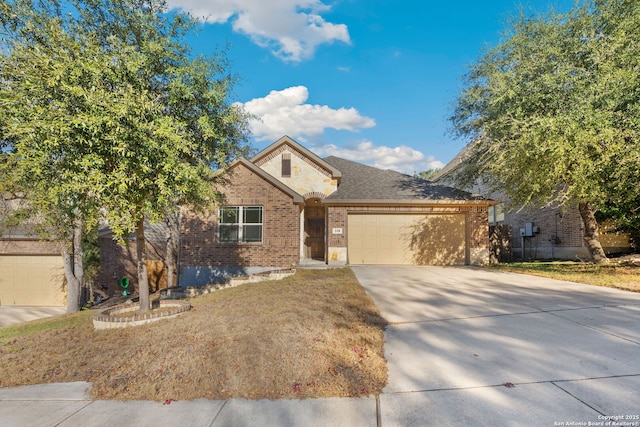 view of front of house with a garage and a front lawn