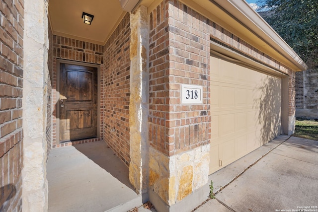 property entrance with a garage