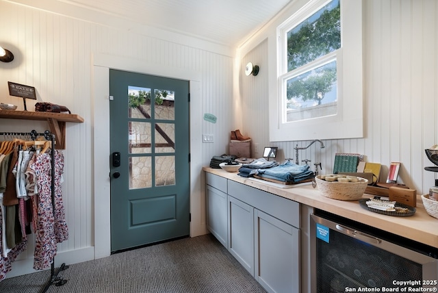 doorway to outside with a wealth of natural light and wine cooler