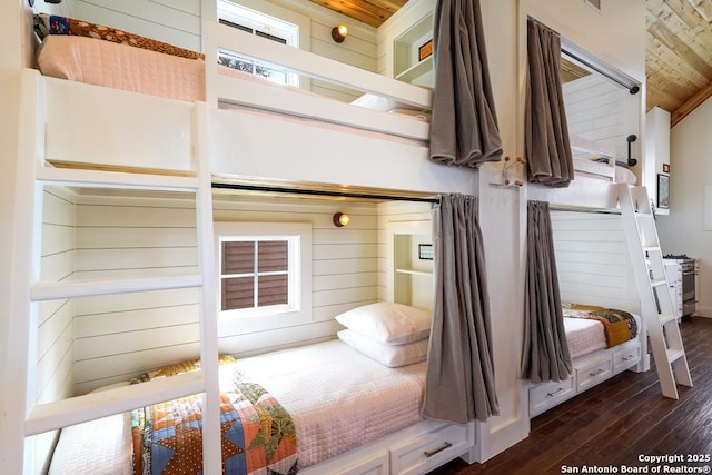 bedroom featuring dark hardwood / wood-style floors and wood ceiling