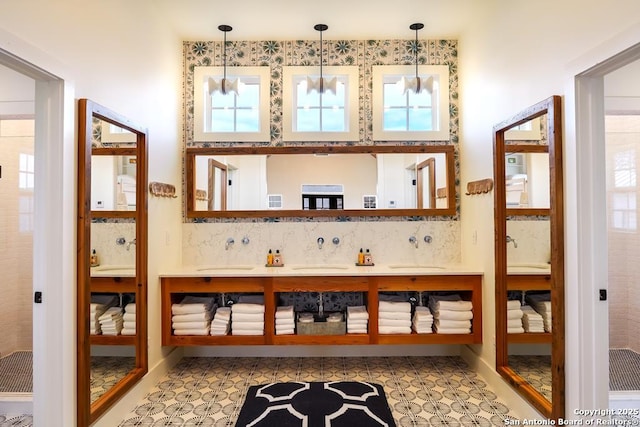 bathroom featuring tasteful backsplash and vanity