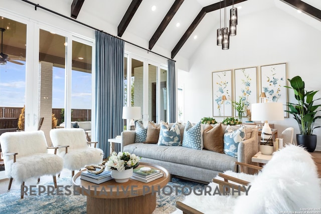 living room featuring ceiling fan, high vaulted ceiling, and beam ceiling