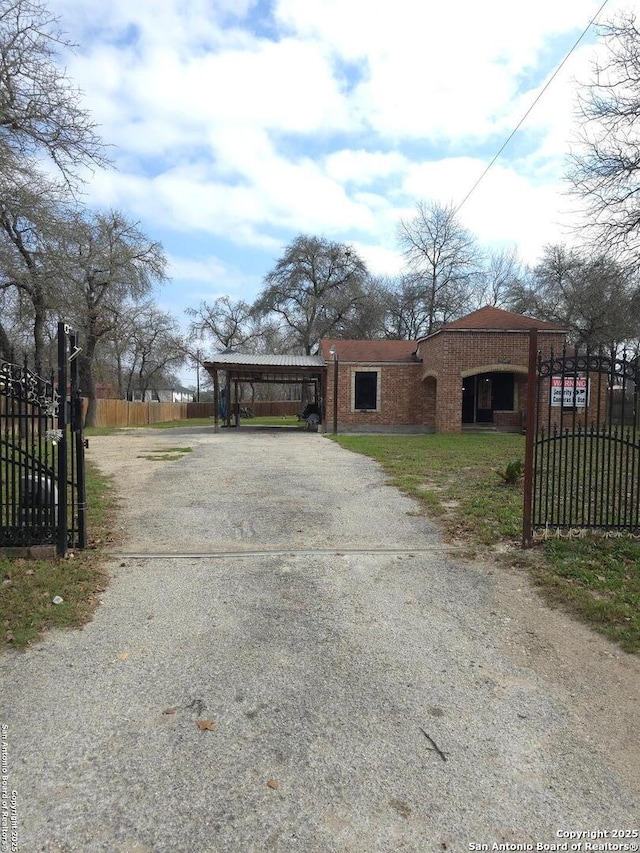 view of front of property featuring a carport