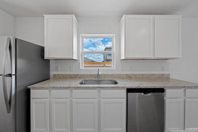 11506 Bald Eagle Hts, San Antonio, TX 78223 - kitchen featuring sink, stainless steel appliances, and white cabinets