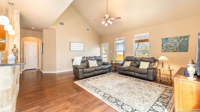 living room featuring high vaulted ceiling, dark hardwood / wood-style floors, and ceiling fan