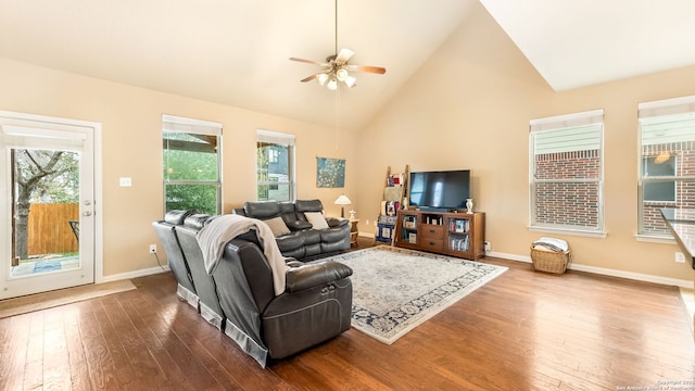 living room with wood-type flooring, high vaulted ceiling, and ceiling fan