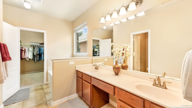 bathroom with vanity and tile patterned floors