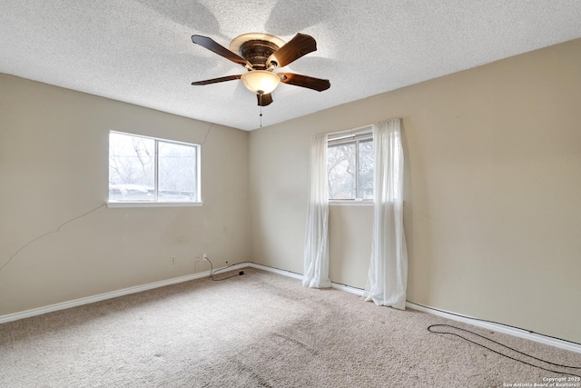 unfurnished room with light carpet, a textured ceiling, and ceiling fan