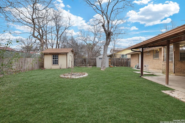 view of yard featuring a patio and a shed