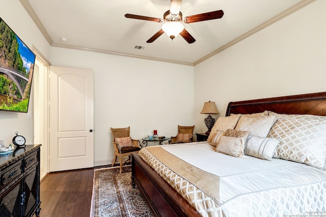 bedroom featuring dark hardwood / wood-style flooring, ornamental molding, and ceiling fan