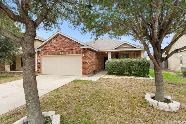 view of front of house featuring a garage and a front lawn