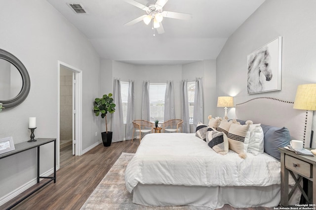 bedroom featuring ceiling fan, dark hardwood / wood-style flooring, and vaulted ceiling