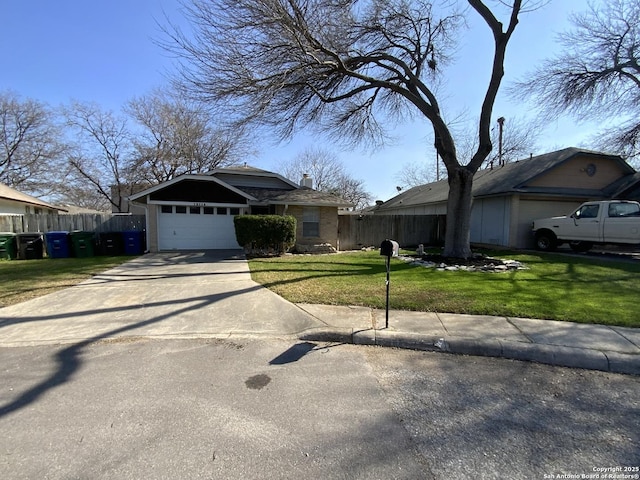 view of front of home featuring a garage and a front yard