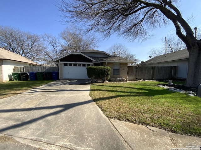 single story home featuring a garage and a front yard