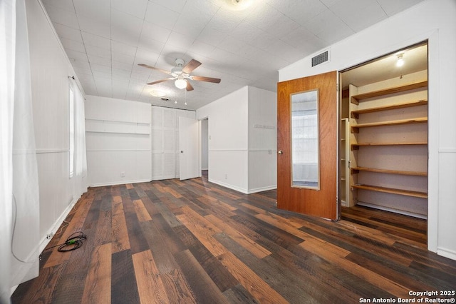 unfurnished bedroom with dark wood-type flooring