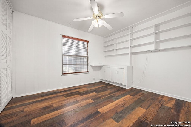 unfurnished bedroom with dark hardwood / wood-style flooring and ceiling fan