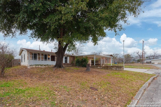 view of front of property with a porch and a front yard