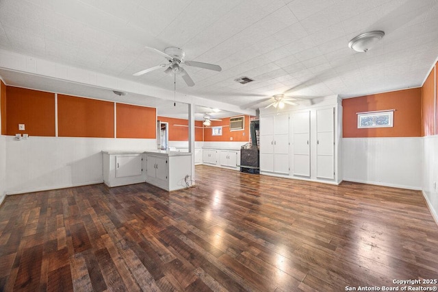 interior space with dark hardwood / wood-style floors and ceiling fan