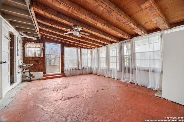 unfurnished sunroom with vaulted ceiling and ceiling fan