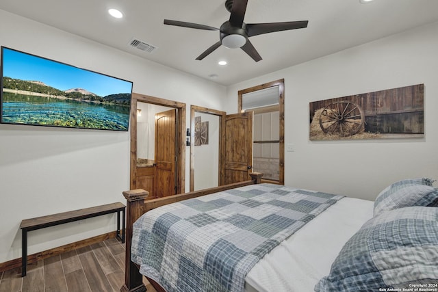 bedroom featuring hardwood / wood-style floors and ceiling fan