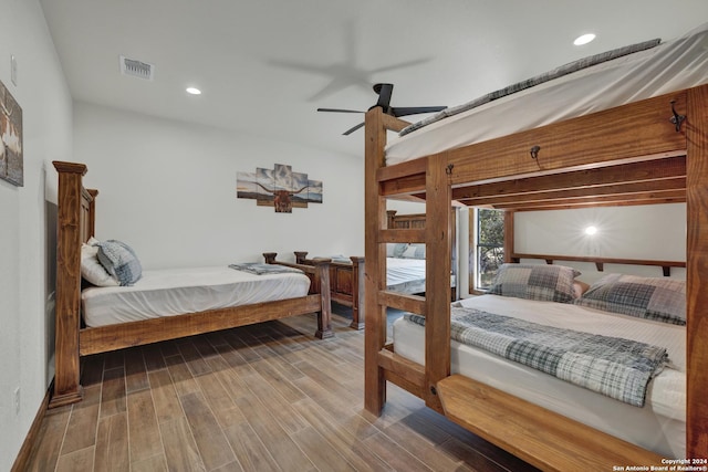 bedroom with ceiling fan and hardwood / wood-style floors