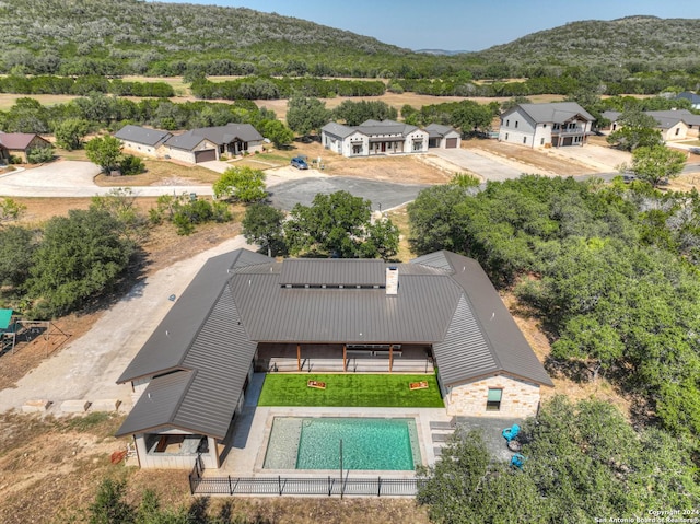 birds eye view of property with a mountain view