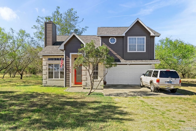 view of front of property with a garage and a front lawn