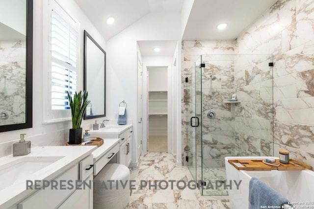 bathroom featuring vanity, separate shower and tub, and vaulted ceiling