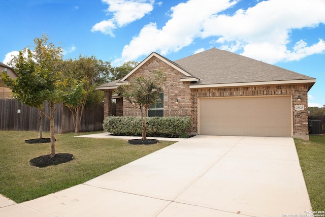 view of front facade featuring cooling unit, a garage, and a front lawn