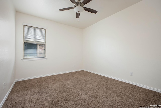 spare room featuring ceiling fan and carpet