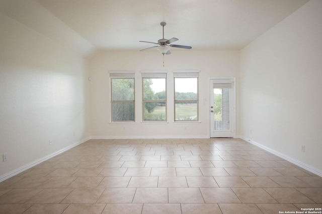 empty room featuring ceiling fan and lofted ceiling