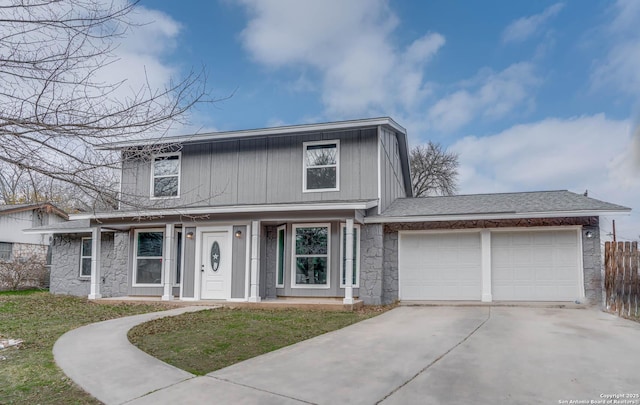 view of front property with a garage and a front lawn