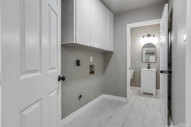 laundry room featuring cabinets, electric dryer hookup, sink, and washer hookup