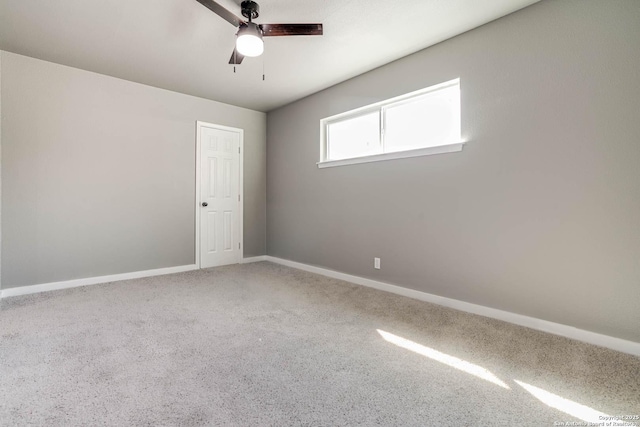 spare room featuring ceiling fan and carpet flooring