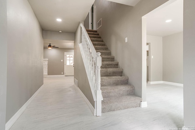 stairs with ceiling fan