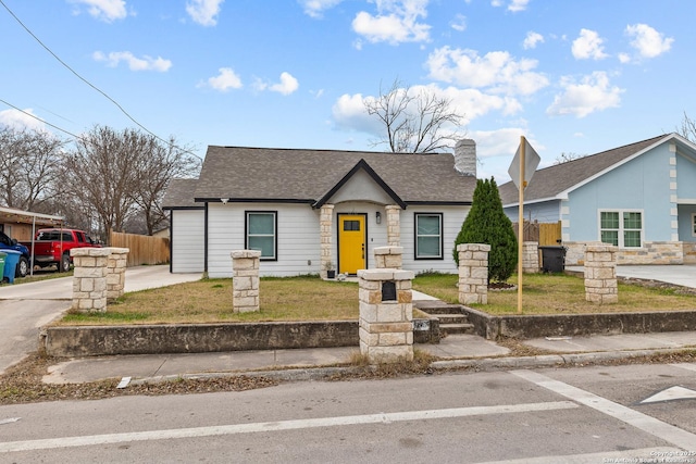 ranch-style house with a front lawn