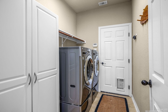 laundry room featuring washing machine and dryer