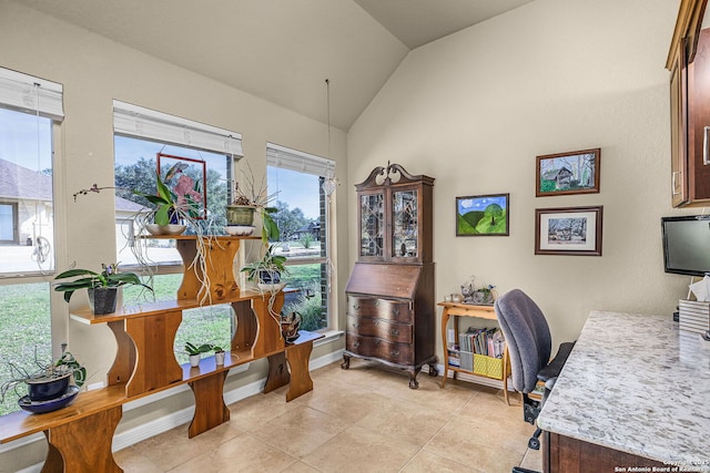 tiled home office featuring lofted ceiling