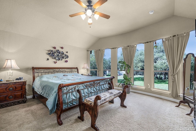 carpeted bedroom with vaulted ceiling and ceiling fan