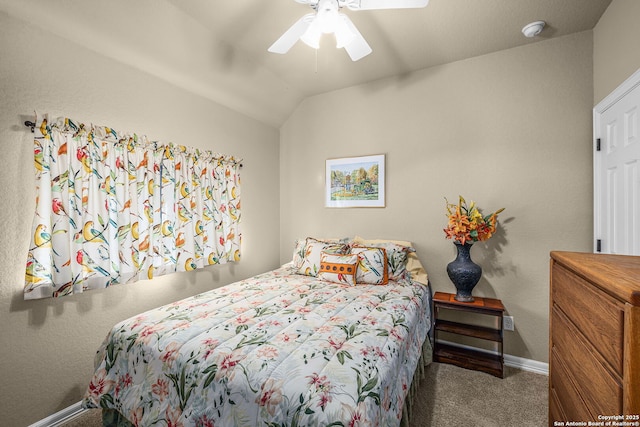 bedroom featuring vaulted ceiling, ceiling fan, and carpet flooring